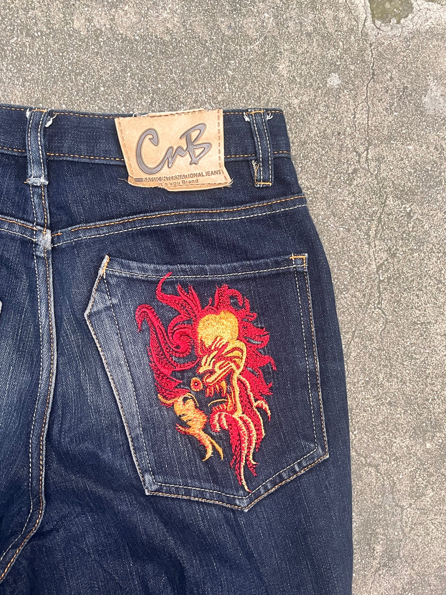 Oniarai flared red mask jeans